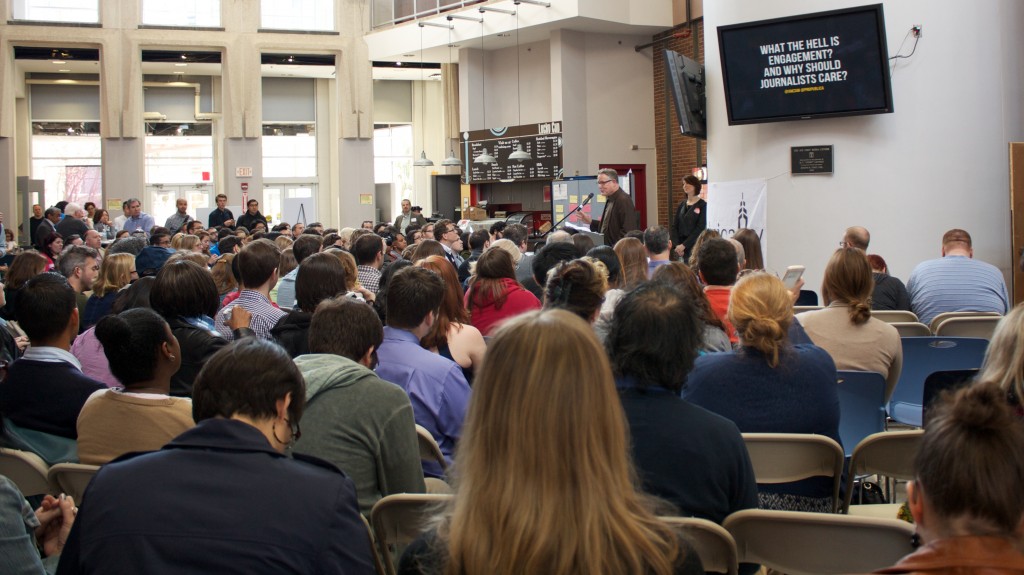 picture of an audience in seats listening to a speaker