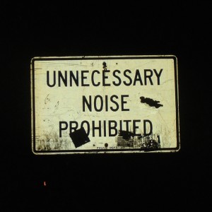 street sign saying "Unnecessary noise prohibited"